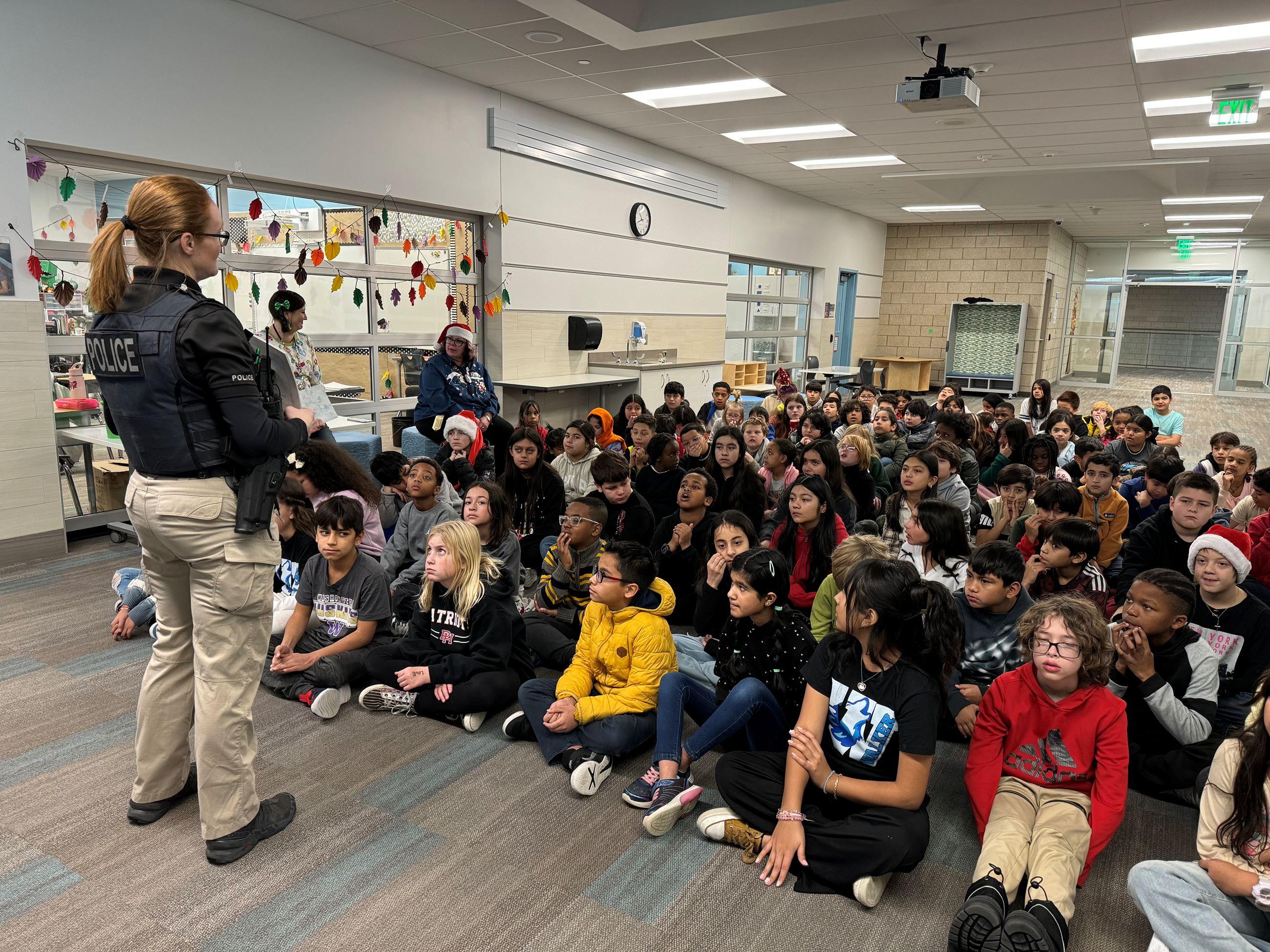 Officer Johnson standing in front of elementary class